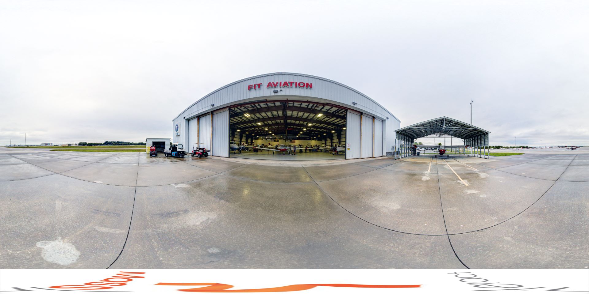 Panoramic view of the entrance to the aviation hangar, from the airplane runway